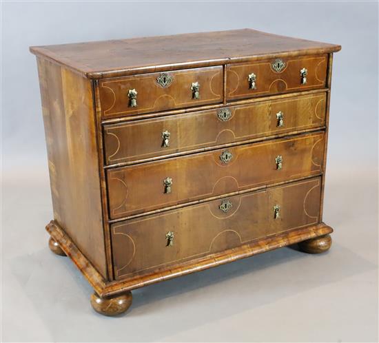 An early 18th century inlaid walnut chest W. 3ft 1in. D. 2ft 11in. H. 2ft 7in.